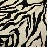 Viscose twill with black zebra print, ivory background