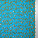 Broderie anglaise festonnée beige Éléonore fond bleu azur