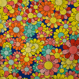 Coton imprimé flower power corail fond bleu roi
