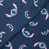 Coton imprimé tête de Stitch fond marine
