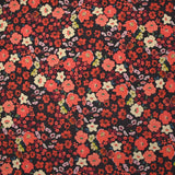Crêpe polyester imprimé fleurs corail fond marron