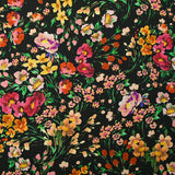 Crêpe viscose imprimé printemps en fleurs fond noir