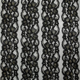 Dentelle polyester à bandes florales or brodées lurex noir