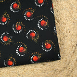 Gabardine de laine mélangée imprimée éclipse orange fond noir