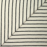 Jersey de coton flammé pointelle rayé noir et blanc cassé