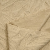 Jersey matelassé fissures fond beige