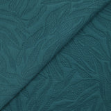 Jersey matelassé fissures fond pétrole