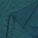 Jersey matelassé fissures fond pétrole