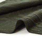 Matelassé jersey fissures military green background
