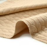 Jersey matelassé tresses fond beige