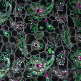 Jersey velours dévoré animal imprimé cachemire vert fond noir