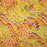 Lin viscose imprimé écailles ensoleillées orange et jaune fond écru