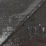 Maille Lurex polyester à paillettes argentées rayées fond noir