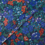 Maille polyester lamé fleurs bleu et rouge fond marine