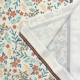 Tissu Maillot de bain recyclé UPF50 fleurs du printemps fond blanc cassé