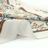 Tissu Maillot de bain recyclé UPF50 fleurs du printemps fond blanc cassé