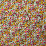 Mousseline crinkle imprimée lurex prairie fleurie rose fond vert d'eau