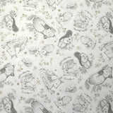 Piqué de coton imprimé les animaux de la forêt vert fond blanc