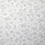 Piqué de coton imprimé papillons et fleurs fond blanc