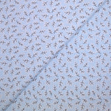 Popeline polycoton imprimée rayée et branche fond bleu