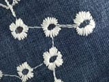 Blue background embroidered polyester twill