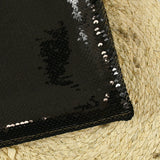 Sequins noirs sur tulle stretch