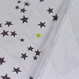 Estrellas de topo mate mate de algodón y verde anís por metro