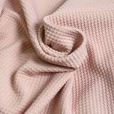 Tissu nid d'abeille rose poudré
