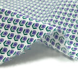 Popeline de coton imprimée fleurs pixelisées violet