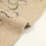 Lainage bouclette fantaisie fleurs fond beige