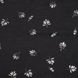 Jersey de coton fin ajouré feuilles fond noir