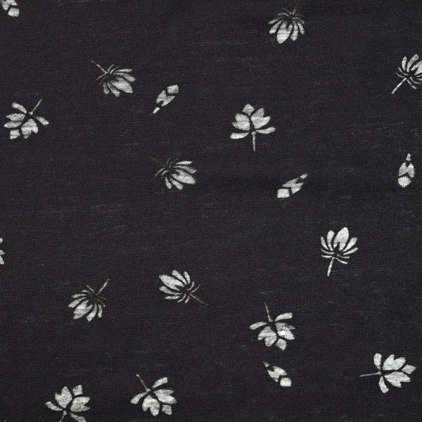 Jersey de coton fin ajouré feuilles fond noir