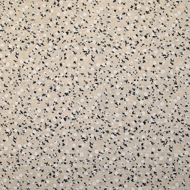 Voile de coton imprimé et floqué fleurettes fond beige clair