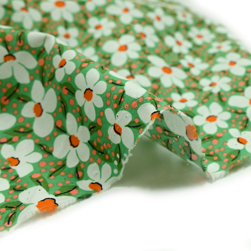 Popeline de coton imprimée pois corail et fleurs orange fond vert