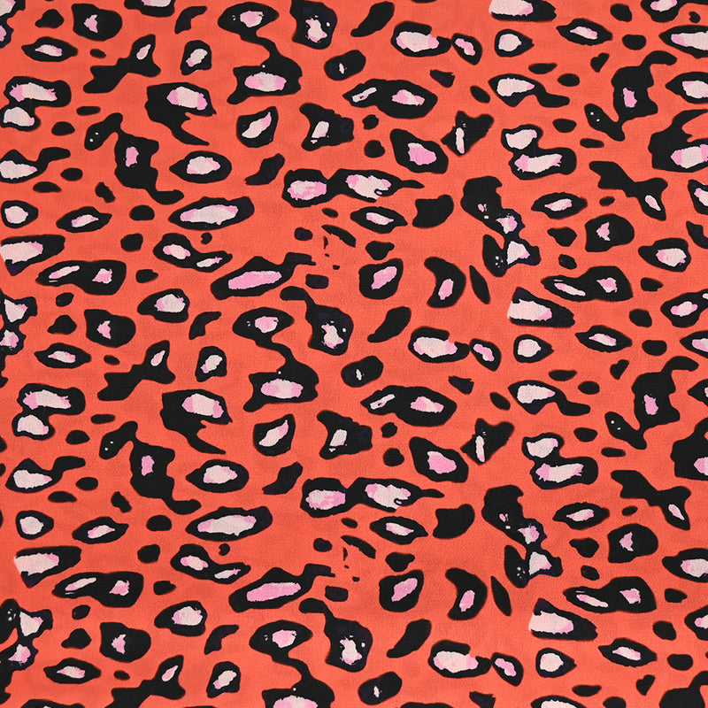 Crêpe satin polyester imprimé safari fond orange corail