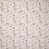 Coton imprimé ouragan floral marron fond blanc