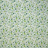 Coton imprimé ouragan floral vert fond blanc