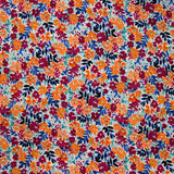 Crêpe de polyester imprimé picore nature orange fond blanc