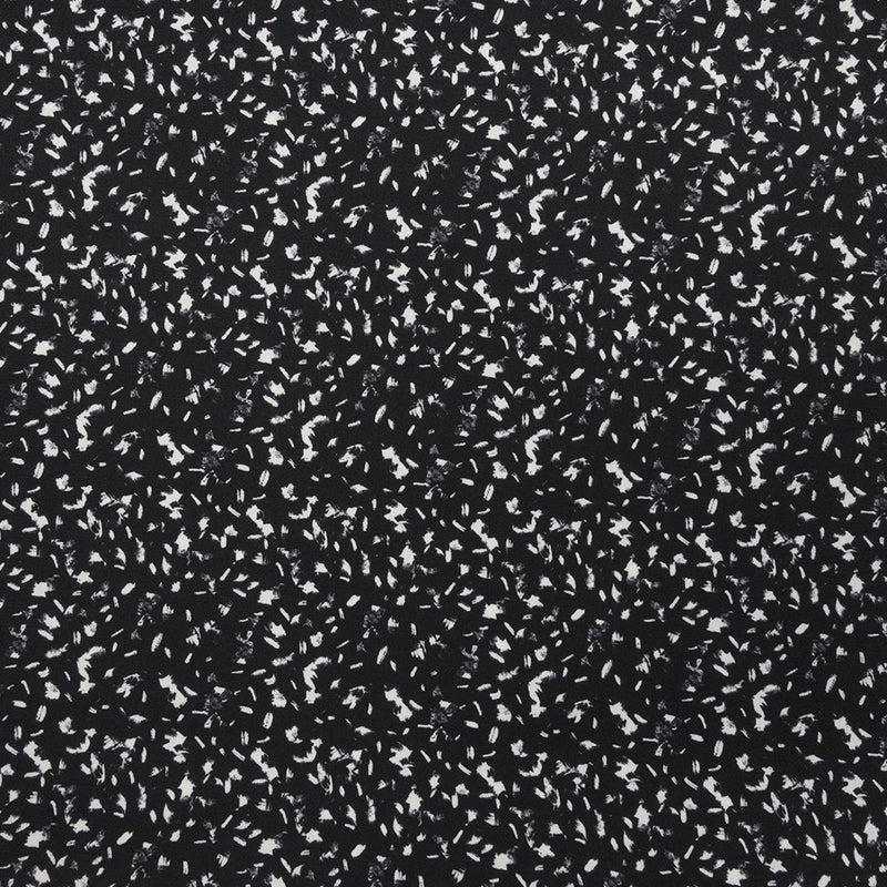 Crêpe polyester imprimé graphique taches blanches fond noir