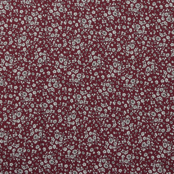 Crêpe viscose imprimé petites fleurs blanches fond bordeaux foncé