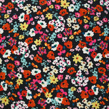 Crépon polyester fleuri multicolore fond noir