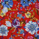 Crépon polyester jolie pivoine bleu fond rouge