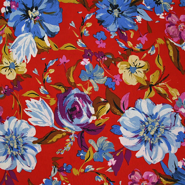 Crépon polyester jolie pivoine bleu fond rouge