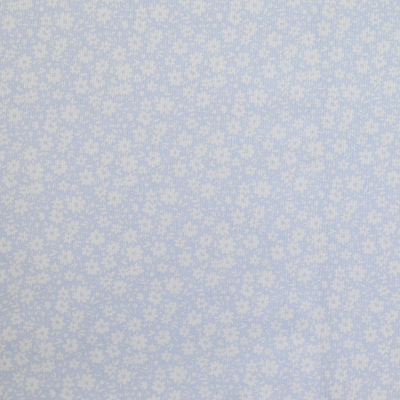 Piqué de coton imprimé fleurs printanière fond bleu clair