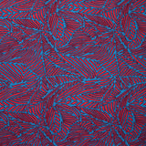 Viscose imprimée fougères orange corail et bleu