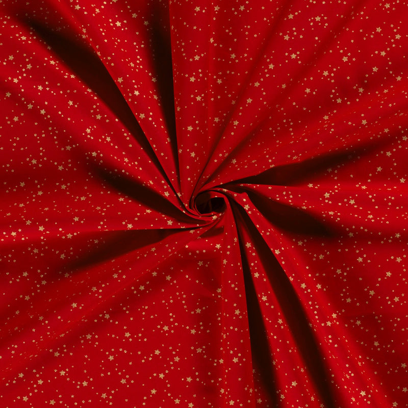 Coton de Noël imprimé tourbillon d'étoiles doré fond rouge