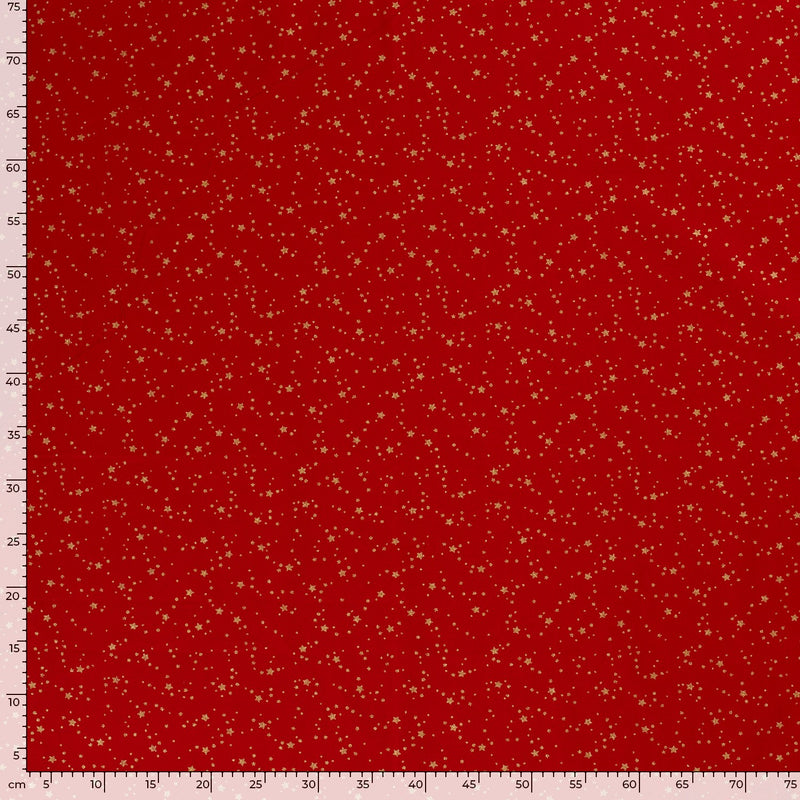 Coton de Noël imprimé tourbillon d'étoiles doré fond rouge