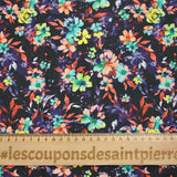Coton imprimé fleuri graphique orange et violet fond noir