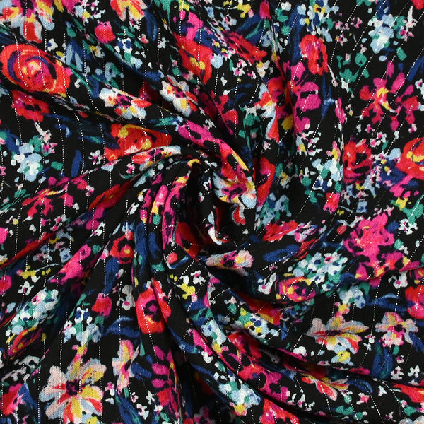 Crépon viscose lurex fleurs en folie fond noir