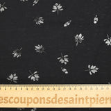 Jersey de coton fin ajouré feuilles fond noir